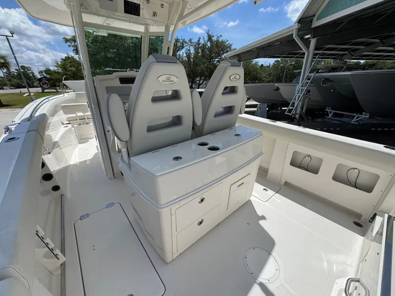 Slide: The Image of 2026 Sailfish 272 CC boat interior with dual seats and storage compartments. - 36