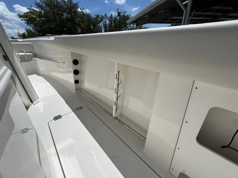 Slide: The Image of 2026 Sailfish 272 CC boat interior with storage compartments and sleek design. - 40