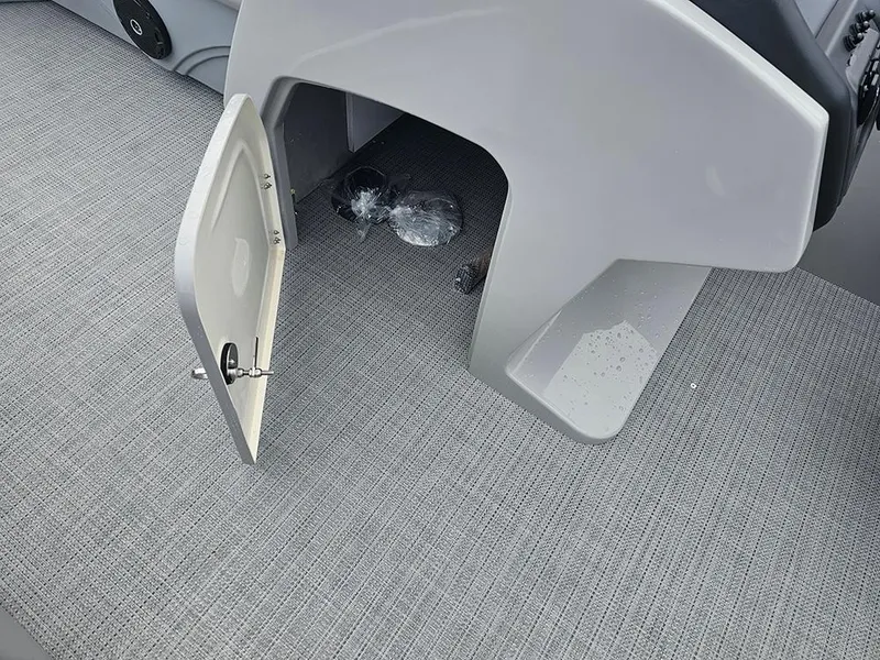 Slide: The Image of 2026 Bentley Pontoons Legacy 243 Cruise helm with steering wheel and captain's chair. - 17