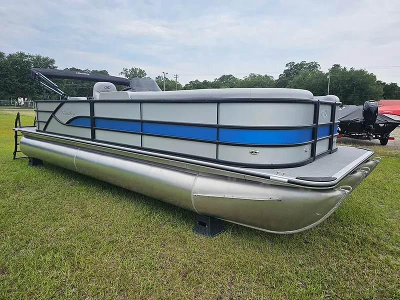 Slide: The Image of 2026 Bentley Pontoons Legacy 243 Cruise on grass with Mercury outboard motor. - 2