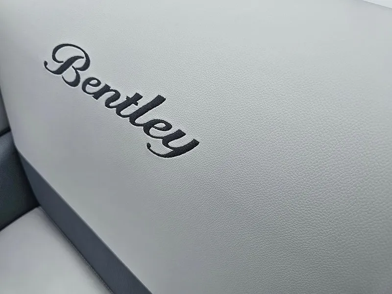 Slide: The Image of Open storage compartment on 2026 Bentley Pontoons Legacy 243 Cruise with gray flooring. - 20