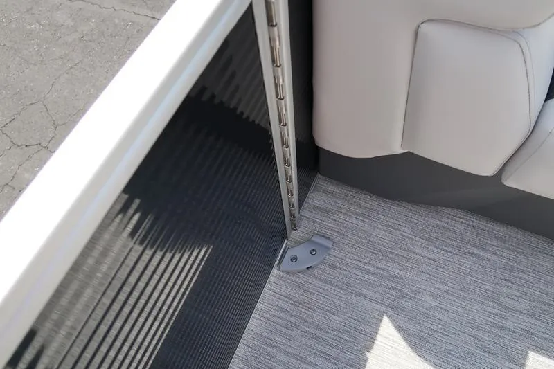 Slide: The Image of 2026 Bennington S Quad Bench 22 SSR interior corner with sleek design and modern upholstery. - 11