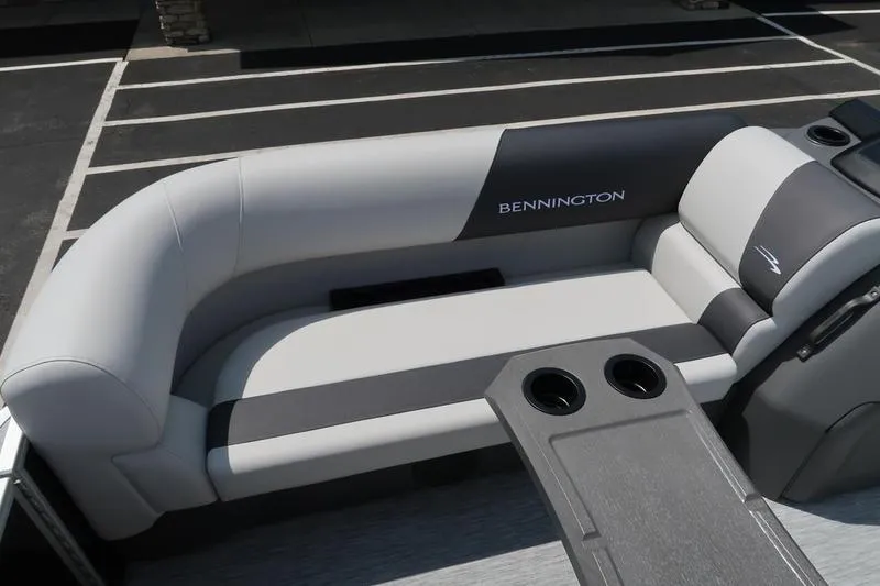 Slide: The Image of 2026 Bennington S Quad Bench 22 SSR boat seating with cup holders, gray and black upholstery. - 17