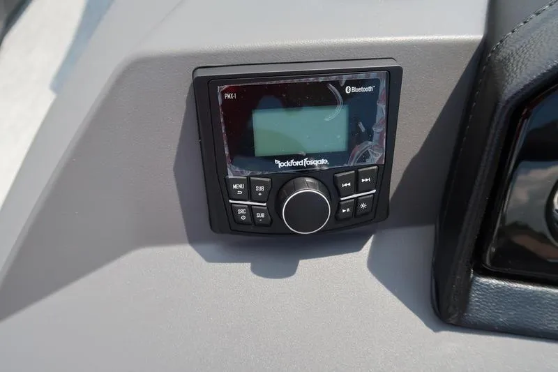 Slide: The Image of Control panel of 2026 Bennington S Quad Bench 22 SSR with Rockford Fosgate audio system. - 22