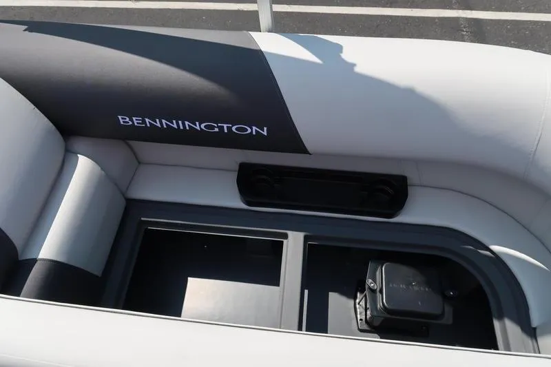 Slide: The Image of 2026 Bennington S Quad Bench 22 SSR interior seating with storage compartments. - 33