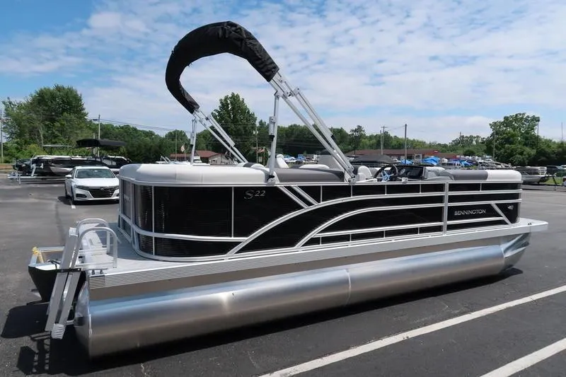 Slide: The Image of 2026 Bennington S Quad Bench 22 SSR pontoon boat in parking lot, sunny day. - 4