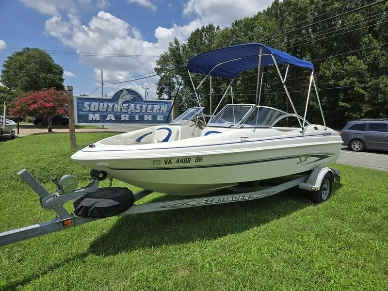 Slide: The Image of 2004 Glastron SX 195 boat on trailer at Southeastern Marine dealership. - 6