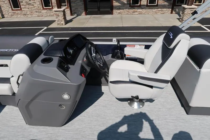 Slide: The Image of 2026 Bennington S Quad Bench 22 SSR boat interior with helm and seating. - 20
