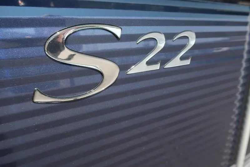 Slide: The Image of 2026 Bennington S Quad Bench 22 SSR with sleek seating and cup holders. - 21