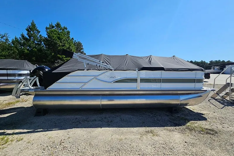 The Image of 2026 Bentley Pontoons 223 Legacy Swingback, covered, parked outdoors on gravel. - 0