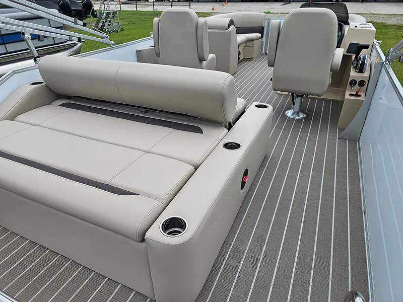 Slide: The Image of 2026 Bentley Pontoons 223 Legacy Swingback on grass, rear view with ladder and canopy. - 10