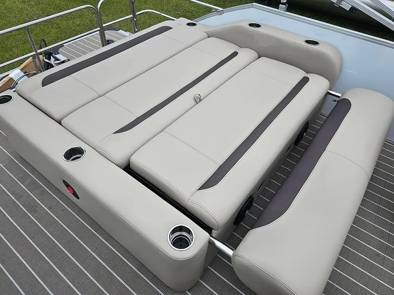 Slide: The Image of 2026 Bentley Pontoons 223 Legacy Swingback with beige seating and cup holders on deck. - 14