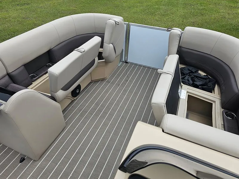 Slide: The Image of 2026 Bentley Pontoons 223 Legacy Swingback interior with open storage compartment and striped flooring. - 23