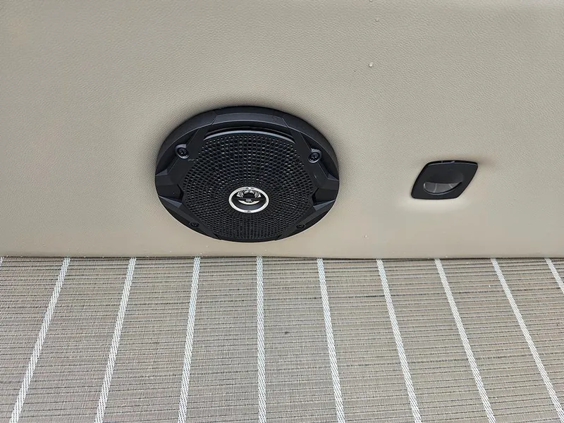 Slide: The Image of 2026 Bentley Pontoons 223 Legacy Swingback interior with beige seating and striped flooring. - 25