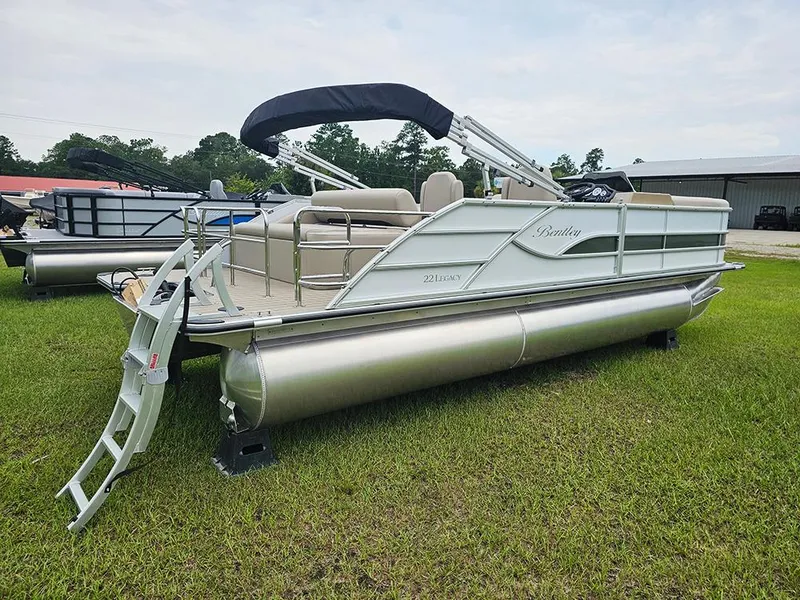 Slide: The Image of 2026 Bentley Pontoons 223 Legacy Swingback on grass, side view. - 3