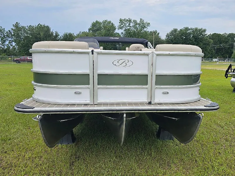 Slide: The Image of 2026 Bentley Pontoons 223 Legacy Swingback on grass, showcasing sleek design and modern features. - 4