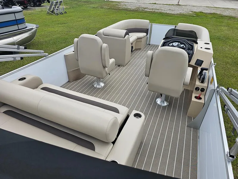 Slide: The Image of 2026 Bentley Pontoons 223 Legacy Swingback on grass, showcasing sleek design and luxury features. - 9