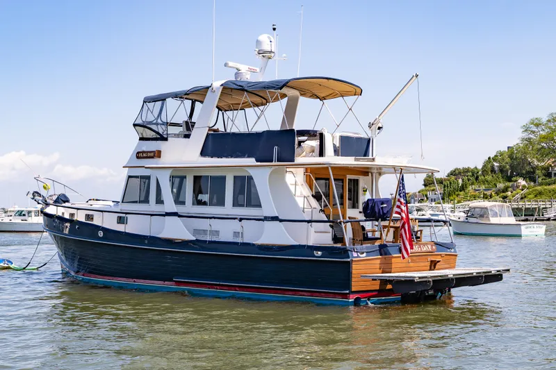 Slide: The Image of Grand Banks 46 Europa 2002 yacht docked in a scenic marina. - 33