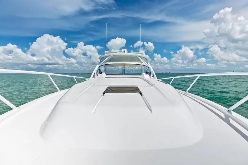 Slide: The Image of 2018 Intrepid 430 Sport Yacht on open water under a vibrant blue sky. - 14