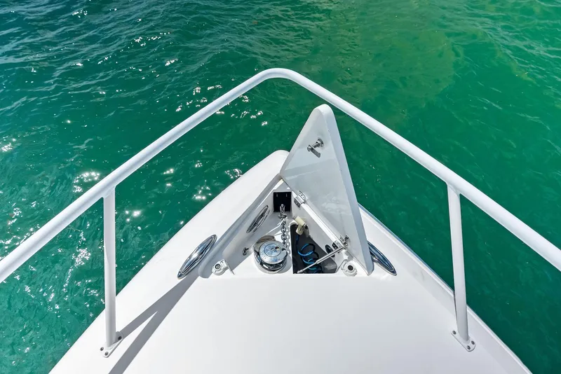 Slide: The Image of Bow view of 2018 Intrepid 430 Sport Yacht on clear turquoise water. - 15