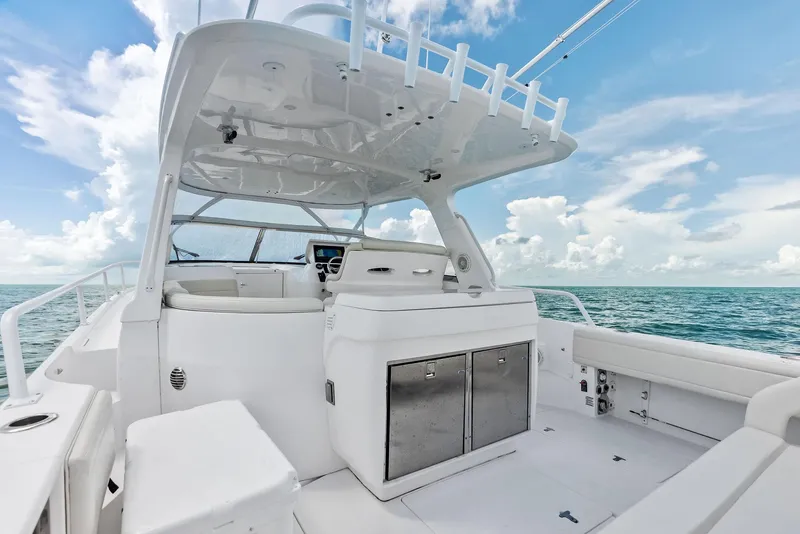 Slide: The Image of 2018 Intrepid 430 Sport Yacht interior with ocean view, featuring sleek white design and modern amenities. - 17