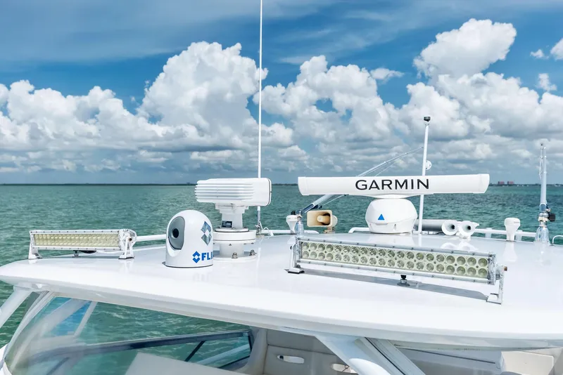 Slide: The Image of 2018 Intrepid 430 Sport Yacht with advanced Garmin navigation equipment on a sunny day. - 19