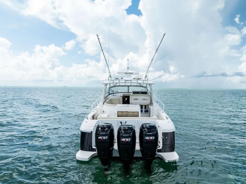 Slide: The Image of 2018 Intrepid 430 Sport Yacht on open sea under blue sky. - 2