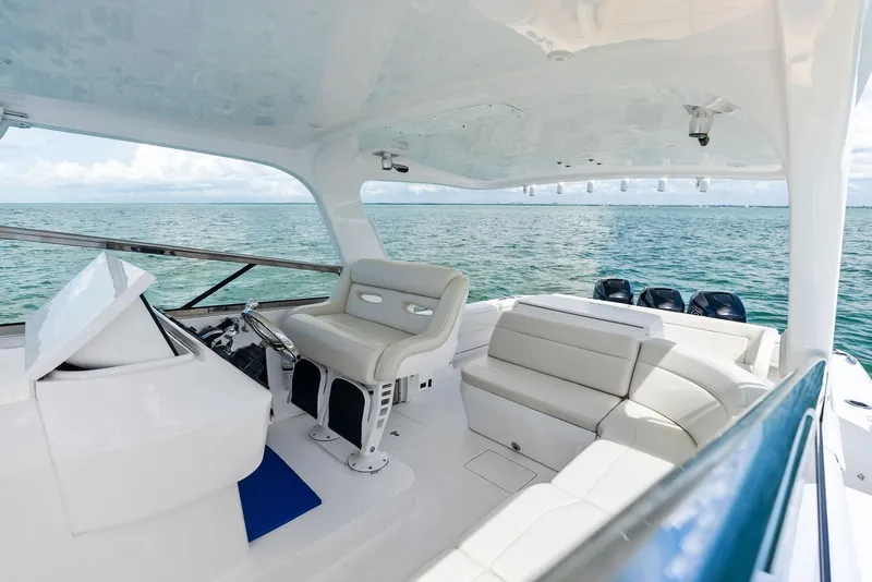 Slide: The Image of 2018 Intrepid 430 Sport Yacht interior with luxurious seating and ocean view. - 20