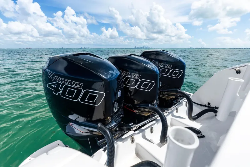 Slide: The Image of Triple Racing 400 engines on a 2018 Intrepid 430 Sport Yacht, cruising on open water. - 24