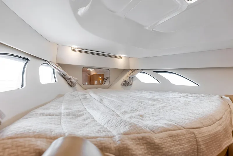 Slide: The Image of Luxurious cabin interior of 2018 Intrepid 430 Sport Yacht with cozy bedding and windows. - 40