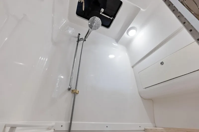 Slide: The Image of Interior shower of 2018 Intrepid 430 Sport Yacht, featuring sleek white design and modern fixtures. - 43