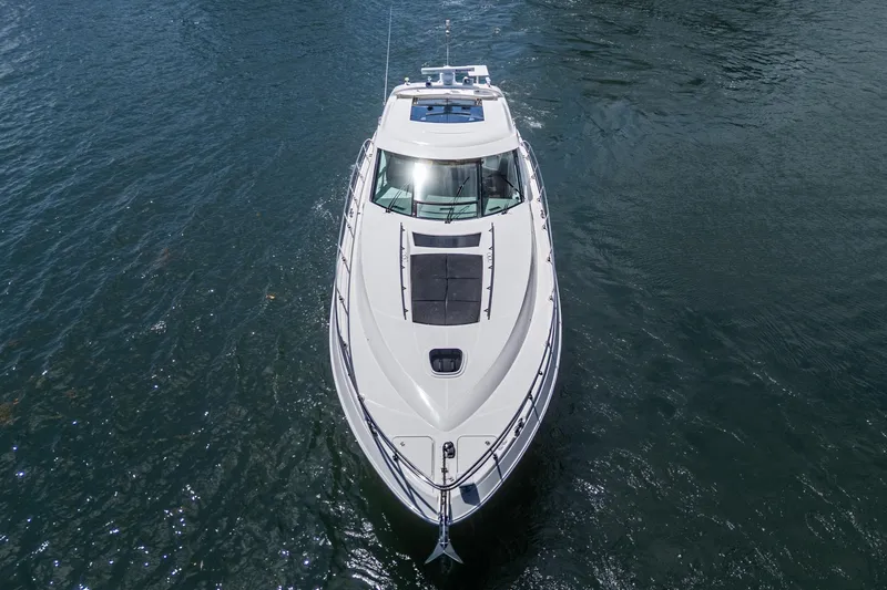 Slide: The Image of 2014 Sea Ray 540 Sundancer yacht cruising on open water, aerial view. - 10