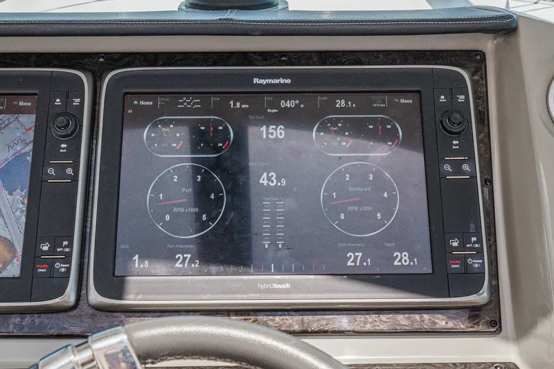 Slide: The Image of Dashboard of 2014 Sea Ray 540 Sundancer with Raymarine navigation display. - 22