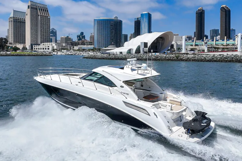Slide: The Image of 2014 Sea Ray 540 Sundancer yacht cruising near city skyline. - 3