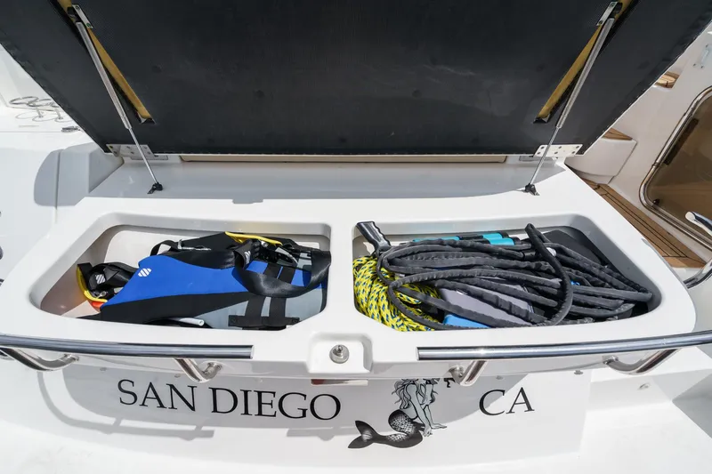 Slide: The Image of 2014 Sea Ray 540 Sundancer storage compartment with water sports gear, San Diego, CA. - 32