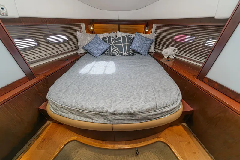 Slide: The Image of Luxurious bedroom interior of 2014 Sea Ray 540 Sundancer yacht with cozy bedding. - 46