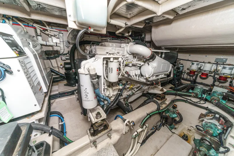 Slide: The Image of Engine room of 2014 Sea Ray 540 Sundancer yacht, showcasing complex machinery and components. - 49