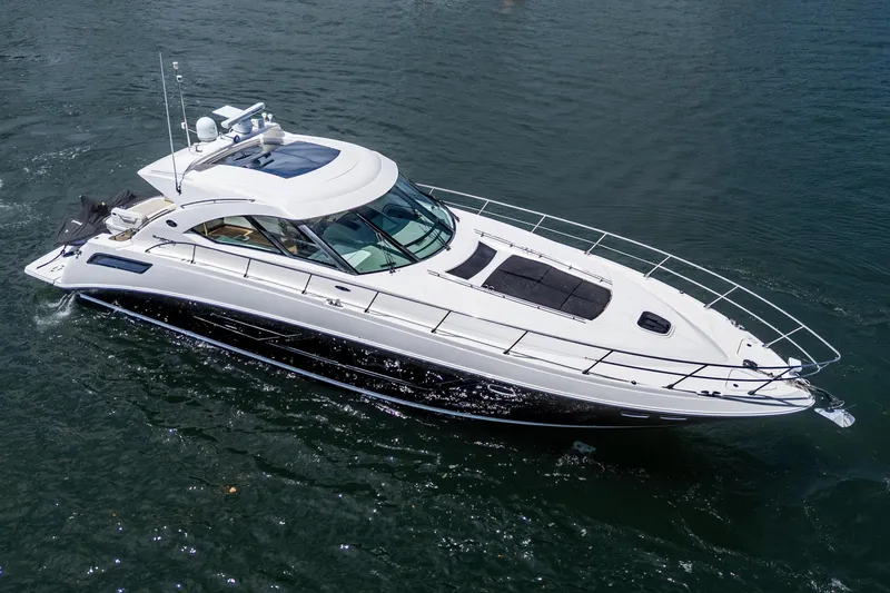 Slide: The Image of 2014 Sea Ray 540 Sundancer yacht cruising on open water. - 8