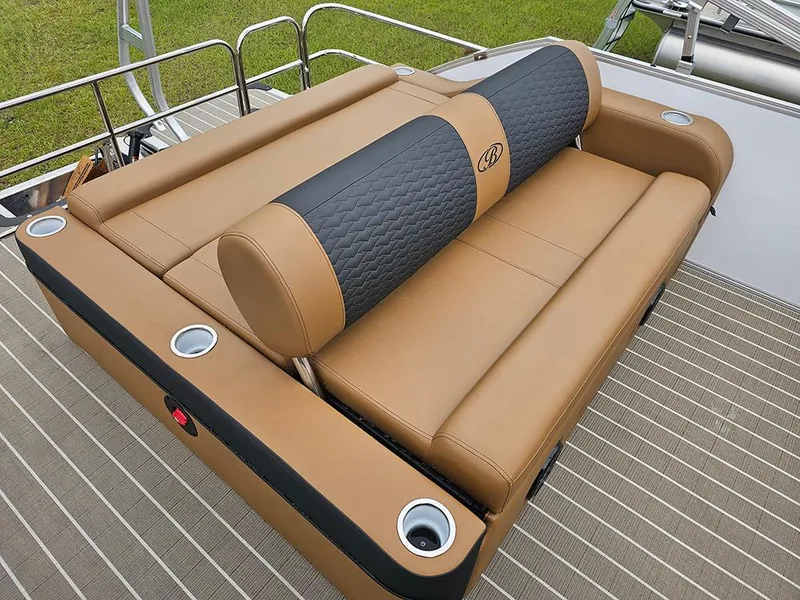 Slide: The Image of 2026 Bentley Pontoons Elite 253 Swingback Tritoon, luxurious tan seating with cup holders. - 11