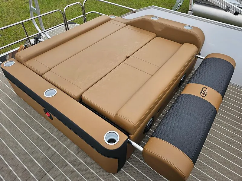 Slide: The Image of Luxurious seating on 2026 Bentley Pontoons Elite 253 Swingback Tritoon, featuring tan and black upholstery. - 12