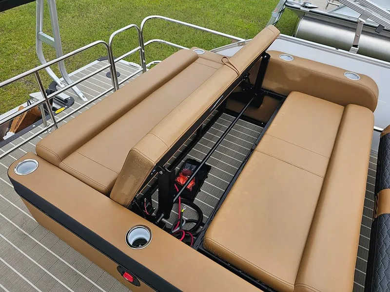 Slide: The Image of 2026 Bentley Pontoons Elite 253 Swingback Tritoon with tan seating and cup holders. - 13