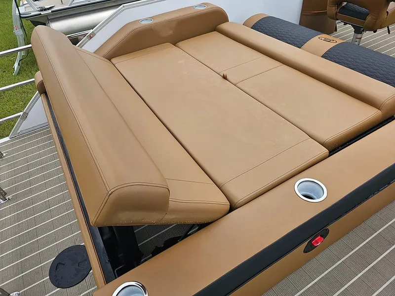 Slide: The Image of 2026 Bentley Pontoons Elite 253 Swingback Tritoon with tan leather seating and cup holders. - 14