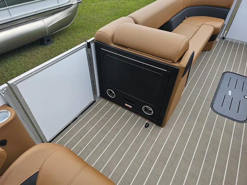 Slide: The Image of 2026 Bentley Pontoons Elite 253 interior with tan seating and striped flooring. - 16