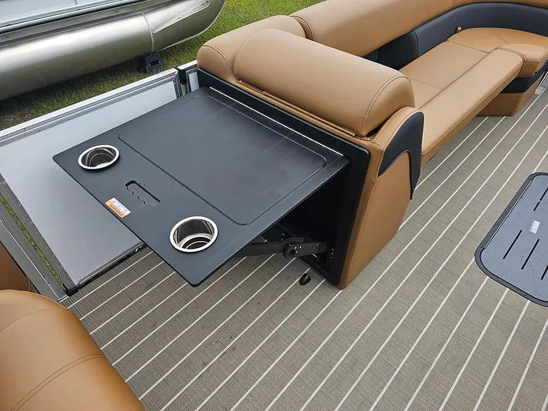 Slide: The Image of 2026 Bentley Pontoons Elite 253 interior with foldable table and cup holders. - 17