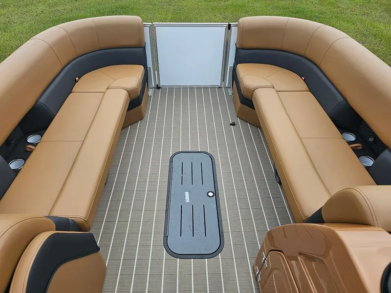 Slide: The Image of 2026 Bentley Pontoons Elite 253 interior with tan seating and striped flooring. - 23
