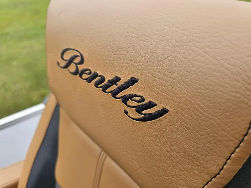 Slide: The Image of Close-up of Bentley Pontoons Elite 253 Swingback seat with embroidered logo, 2026 model. - 27