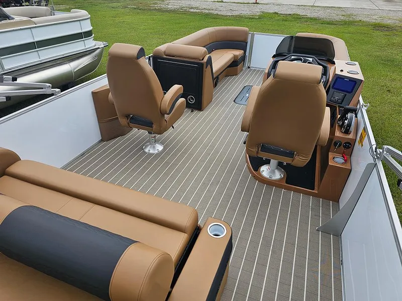 Slide: The Image of 2026 Bentley Pontoons Elite 253 interior with dual captain seats and luxurious seating. - 7