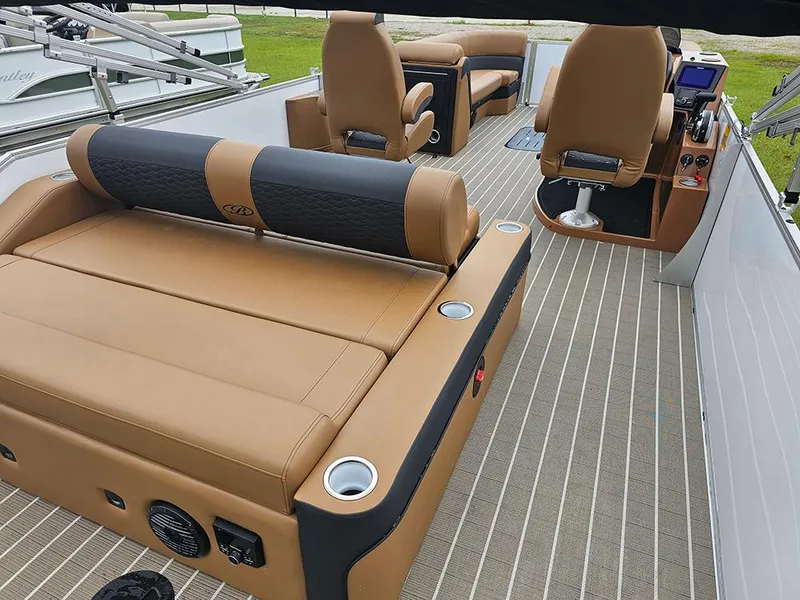 Slide: The Image of 2026 Bentley Pontoons Elite 253 interior with tan leather seating and dual captain chairs. - 8