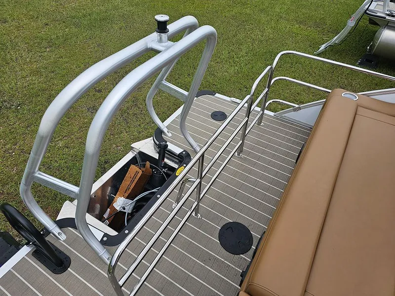 Slide: The Image of 2026 Bentley Pontoons Elite 253 Tritoon deck with swingback seating and safety railings. - 9