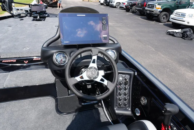 Slide: The Image of 2026 Phoenix 721 ZXL boat dashboard with steering wheel and electronic display. - 10